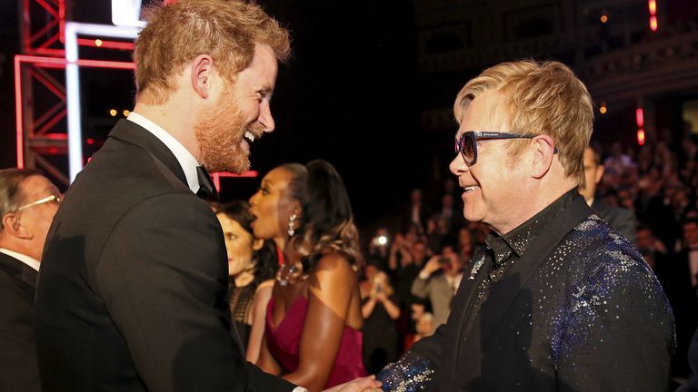 Prince Harry greets Elton John after the Royal Variety Performance at the Albert Hall in London, November 13, 2015. REUTERS/Paul Hackett - RTS6WBP