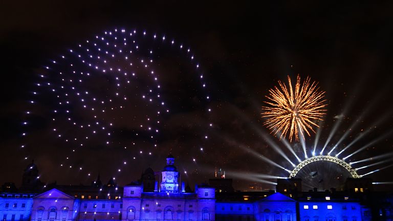 Drones light up the sky over the London Eye in central London during the New Year celebrations. Picture date: Sunday January 1, 2023.