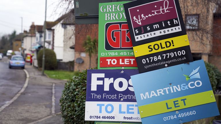 Estate agent boards outside a property. File Pic