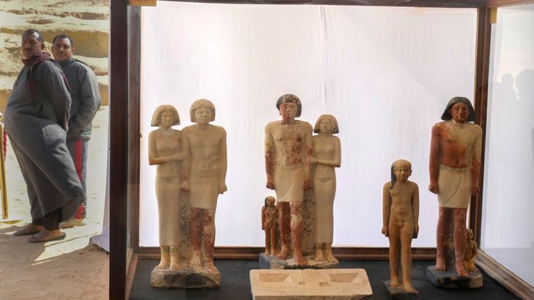 Egyptian antiquities guarders stand behind recently discovered artifacts at the site of the Step Pyramid of Djoser in Saqqara
Pic:AP
Pic:AP