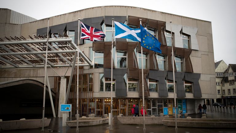 Flags fly outside the Scottish Parliament