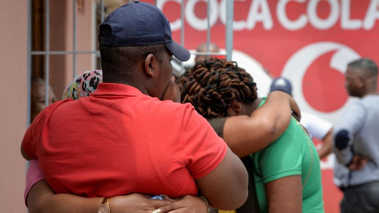 Family members of the victims of a mass shooting at a birthday party that left eight dead, comfort one another at the scene during a visit by a high-level police delegation the day after the shooting in Kwazakhele, Gqeberha, South Africa. January 30, 2023. REUTERS/Deon Ferreira