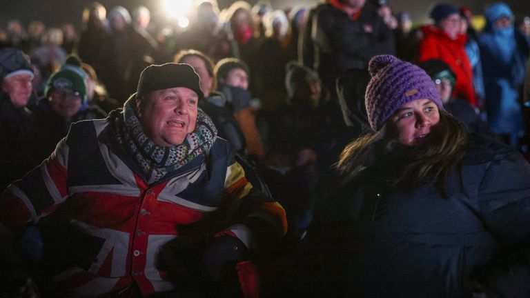 People watch Britain&#39;s first satellite launch on a screen, at Cornwall Airport Newquay, in Cornwall, Britain January 9, 2023. REUTERS/Henry Nicholls