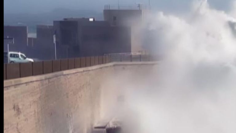 Vry high waves crash into a seawall in Mallorca