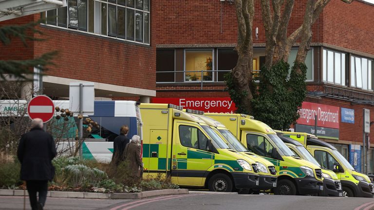 People walk past ambulances outside St George’s University Hospital, which has declared a critical incident due to bed shortages, in London, Britain, January 5, 2023. REUTERS/Henry Nicholls
