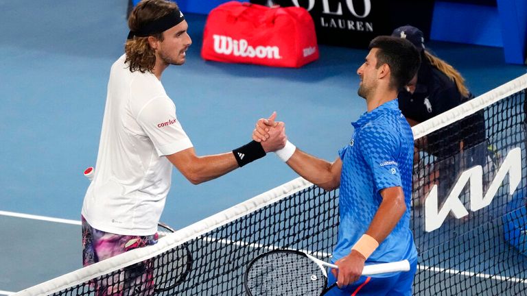 Novak Djokovic, right, of Serbia is celebrated by Stefanos Tsitsipas of Greece following the men&#39;s singles final at the Australian Open tennis championship in Melbourne, Australia, Sunday, Jan. 29, 2023. (AP Photo/Mark Baker)