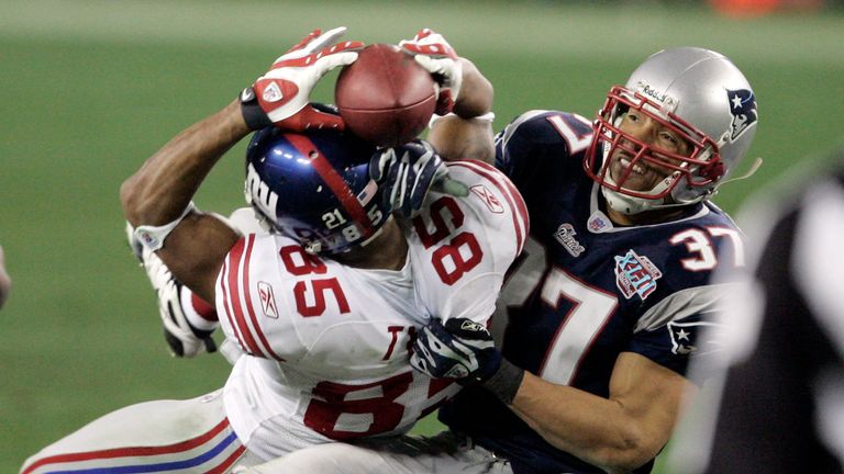 New York Giants receiver David Tyree (85) holds on by his fingertips to a 32-yard pass. Pic: AP