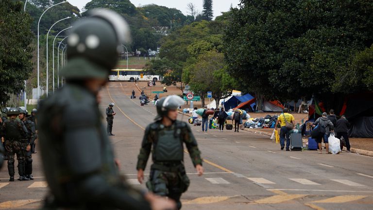 Supporters of Brazil&#39;s former President Jair Bolsonaro leave a camping in front of the the Army Headquarters in Brasilia, Brazil