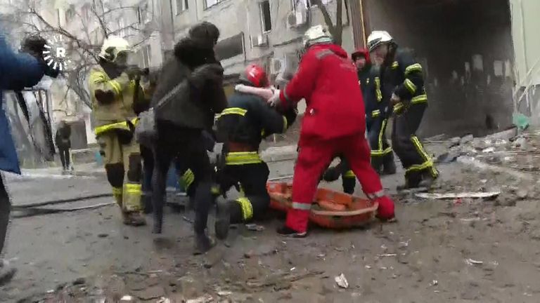Rescue workers pull a woman out of the rubble of a building after a Russian missile attack in Dnipro, Ukraine. 