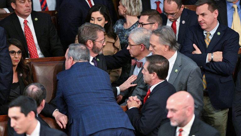 Members of the House of Representatives get physical with each other as Rep. Andy Harris (R-MD) pushes back Rep. Mike Rogers (R-AL) and Rep. Patrick McHenry (R-NC) away from Rep. Matt Gaetz (R-FL) and members of the House Freedom Caucus including Rep. Lauren Boebert (R-CO) after Gaetz voted "present" rather than voting for McCarthy in a late night 14th round of voting for a new House Speaker on the fourth day of the 118th Congress at the U.S. Capitol in Washington, U.S., January 6, 2023. REUTERS