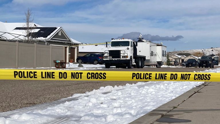 Police vehicles continue their investigations at the home in suburban Enoch, Utah. Picture: AP