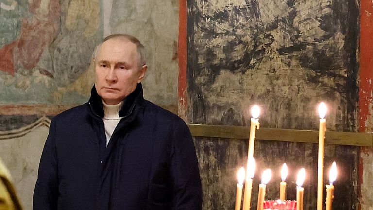 Vladimir Putin attends an Orthodox Christmas service at the Kremlin in Moscow.