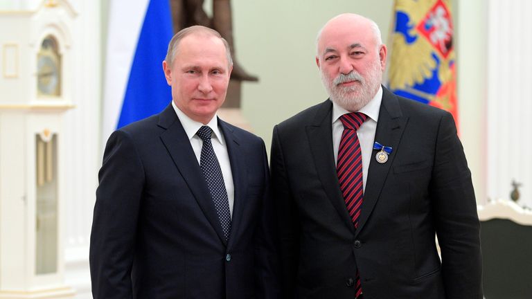 Vladimir Putin poses for a photo with Renova CEO Viktor Vekselberg at an awards ceremony at the Moscow Kremlin Pic:AP
