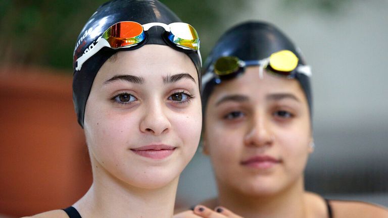 Yusra, left and Sarah Mardini, pose during a training session in Germany in 2015. Pic: AP 