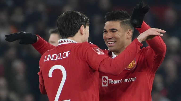 Manchester United&#39;s Casemiro, right, celebrates with teammate Manchester United&#39;s Victor Lindelof after scoring the opening goal of the game during the English FA Cup 4th round soccer match between Manchester United and Reading at Old Trafford in Manchester, England, Saturday, Jan. 28, 2023. (AP Photo/Rui Vieira)