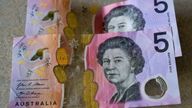 Australian $5 notes pictured in Sydney in 2022. Pic: AP 