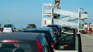 Calais, France - April 11th, 2017: Car wait in line to board a cross-channel ferry at the Port of Calais, France heading for Dover, England on a sunny spring afternoon. Calais is the largest port in France for passenger traffic.