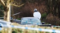 A forensic investigator from Police Service of Northern Ireland (PSNI) at the sports complex in the Killyclogher Road area of Omagh, Co Tyrone, where off-duty PSNI Detective Chief Inspector John Caldwell was shot a number of times by masked men in front of young people he had been coaching. Mr Caldwell remains in a critical but stable condition in hospital following the attack on Wednesday evening. Picture date: Thursday February 23, 2023.