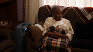 Jeanette Mahlangu uses an at-home oxygen concentrator 
