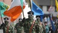Masked members of the Real IRA at a Republican Easter commemoration ceremony at Creggan cemetery in Londonderry.