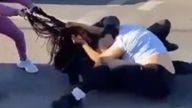 A suspect is seen pulling the black girl&#39;s braids in the footage Pic: Twitter