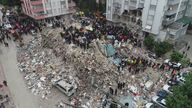 People search through rubble following an earthquake in Adana, Turkey  
Pic: Ihlas News Agency/Reuters