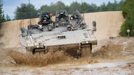 An Ajax Ares tank, an armored personnel carrier, is driven on the training range, during a visit by Defence Secretary Ben Wallace, who is viewing Ukrainian soldiers training on Challenger 2 tanks, at Bovington Camp, a British Army military base in Dorset, Britain, February 22, 2023. Ben Birchall/Pool via REUTERS