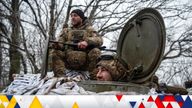 Ukrainian servicemen look on from a military vehicle at their positions near a front line, amid Russia&#39;s attack on Ukraine, in Donetsk region 