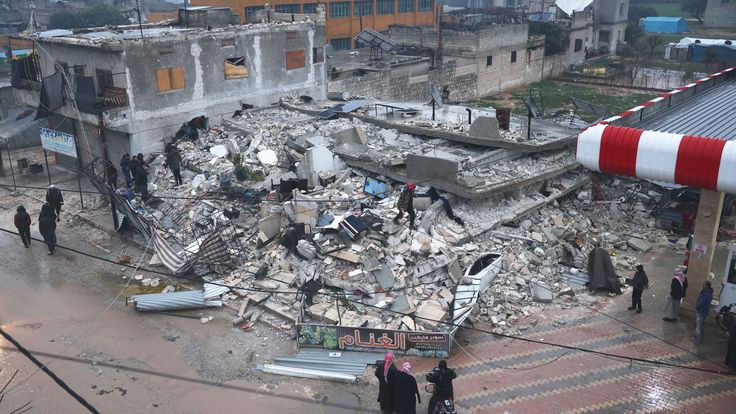 People search a collapsed building following an earthquake in Azmarin town, Idlib province, northern Syria 
Pic:AP