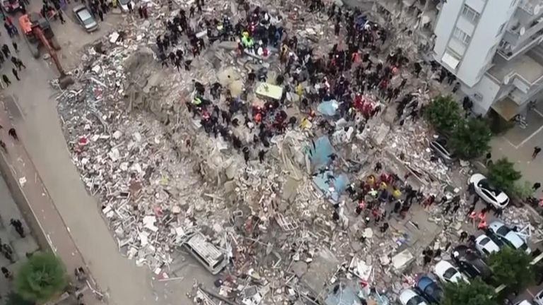 Drone shows overhead view of collapsed building in Turkey after 7.8-magnitude earthquake struck the region
