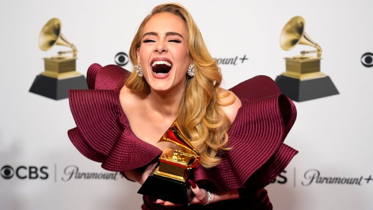Adele, winner of the award for best pop solo performance for "Easy on Me," poses in the press room at the 65th annual Grammy Awards on Sunday, Feb. 5, 2023, in Los Angeles. (AP Photo/Jae C. Hong)