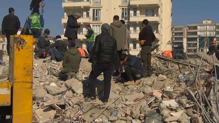 Search of earthquake rubble stops and starts in Turkey while rescuers listen for potential shouting