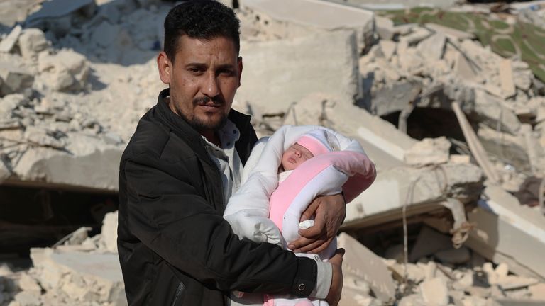 Khalil al-Sawadi holds his niece Afraa, a baby girl who was born under the rubble caused by an earthquake that hit Syria and Turkey. Pic: AP