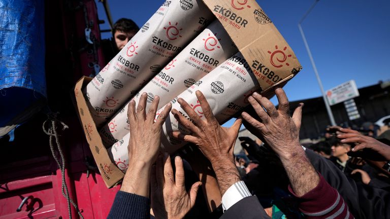 Volunteers distribute aid to people in Antakya, southern Turkey 
Pic:AP
