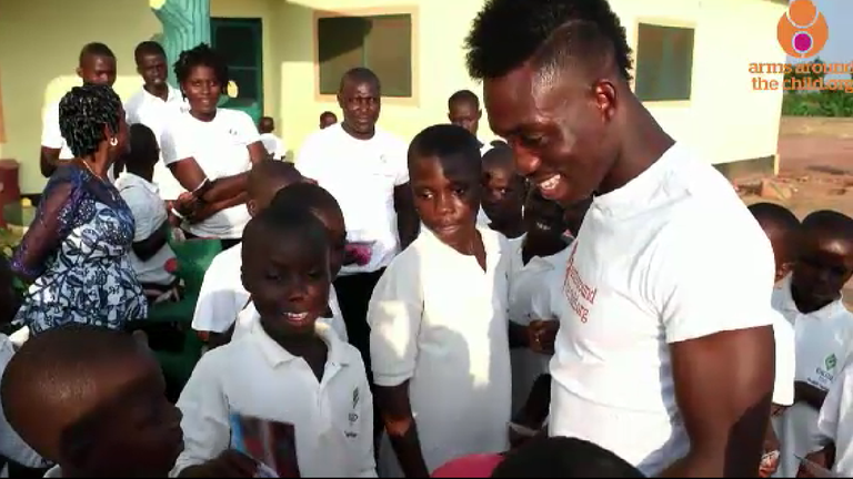 Atsu meets a group of boys at Becky&#39;s House during one of several visits to the orphanage