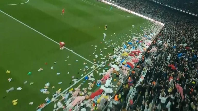 Besiktas fans threw toys and clothes on the football pitch for the children affected by the earthquakes in Turkey