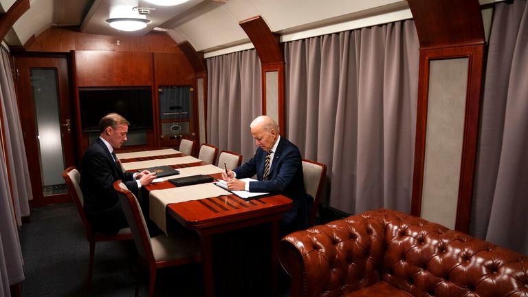 Joe Biden sits on the train with his National Security Advisor Jake Sullivan. Pic: AP
