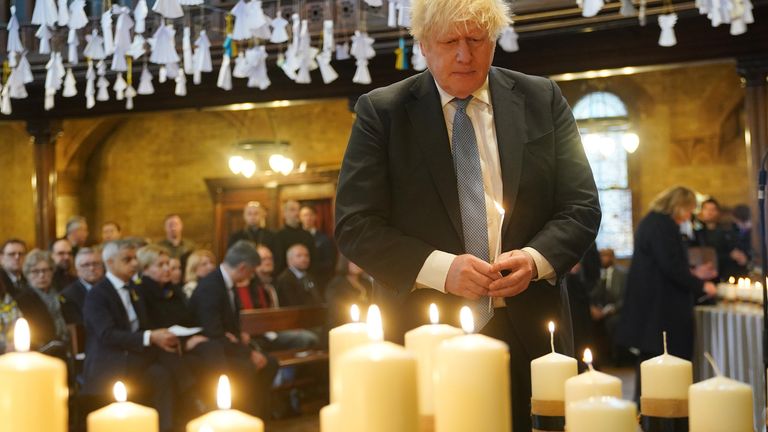 Former prime minister Boris Johnson lights one of 52 candles - one for each week of the war - during an ecumenical prayer service at the Ukrainian Catholic Cathedral in London, to mark the one year anniversary of the Russian invasion of Ukraine. Picture date: Friday February 24, 2023.