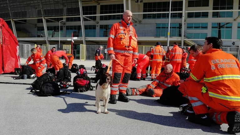  Members of the UK&#39;s International Search & Rescue Team prepare their kit on arrival in Hatay 
Credit:FCDO