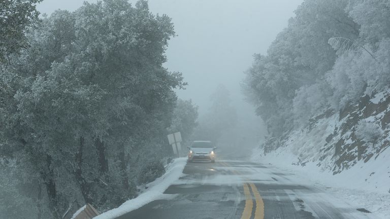 View of an icy road as a massive winter storm passes along the West coast, on Mount Hamilton near San Jose, California, U.S., February 23, 2023. REUTERS/Laure Andrillon
