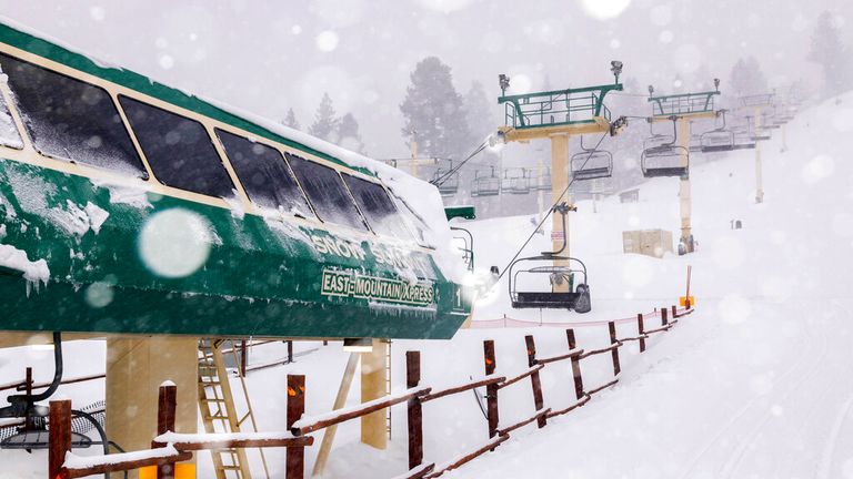 In this photo provided by Big Bear Mountain Resort, snow falls at the resort in Big Bear, Calif., Saturday, Feb. 25, 2023.  (Lee Stockwell/Big Bear Mountain Resort via AP)