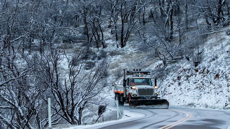 Snowplows on Mount Hamilton Road in unincorporated Santa Clara County, California. Thursday, February 23, 2023.  (Stephen Lam/San Francisco Chronicle, AP)