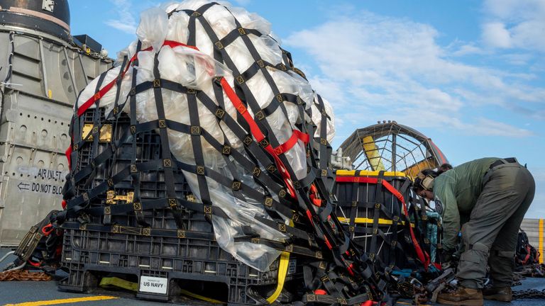 U.S. Navy sailors assigned to Assault Craft Unit 4 prepare material recovered in the Atlantic Ocean from a high-altitude Chinese balloon shot down by the U.S. Air Force off the coast of South Carolina 
Pic:U.S. Navy/Reuters