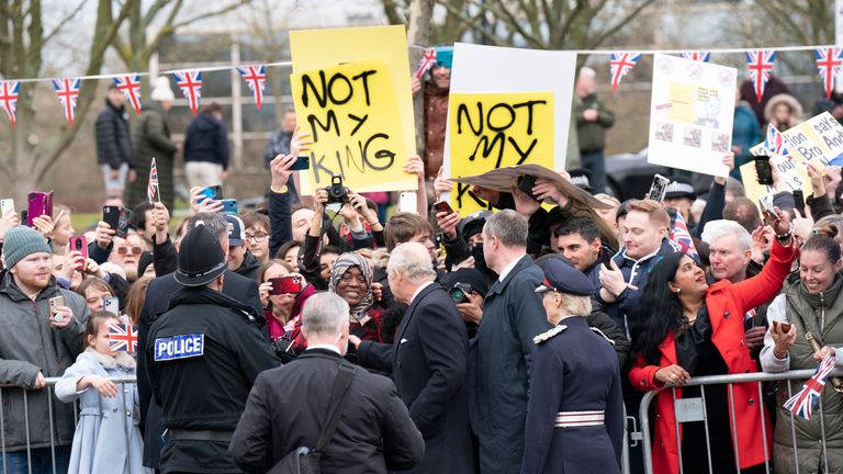 People rain anti-monarchy banners as Britain&#39;s King Charles interacts with the public during his visit to Milton Keynes, Britain, Thursday Feb. 16, 2023. (Arthur Edwards/Pool via AP)