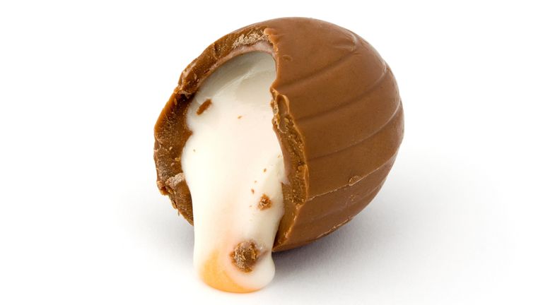 Cream filled chocolate easter egg over white