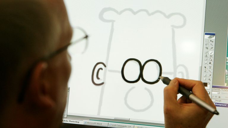 Scott Adams, creator of the comic strip Dilbert, poses for a portrait with the Dilbert character in his studio in Dublin, California. Pic: AP