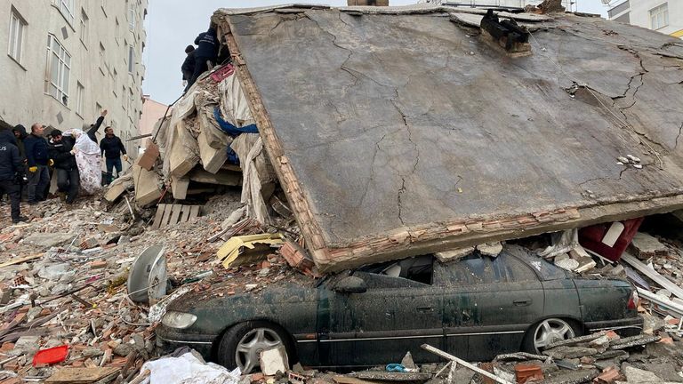 People search through rubble following an earthquake in Diyarbakir, Turkey 