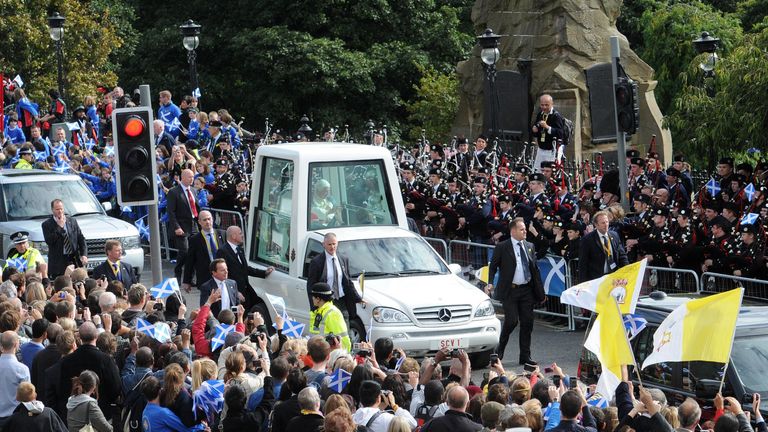 NOTE ALTERNATE CROP. Pope Benedict XVI rides in the Popemobile down Edinburgh&#39;s Princes Street on the first day of his four day visit to the United Kingdom.