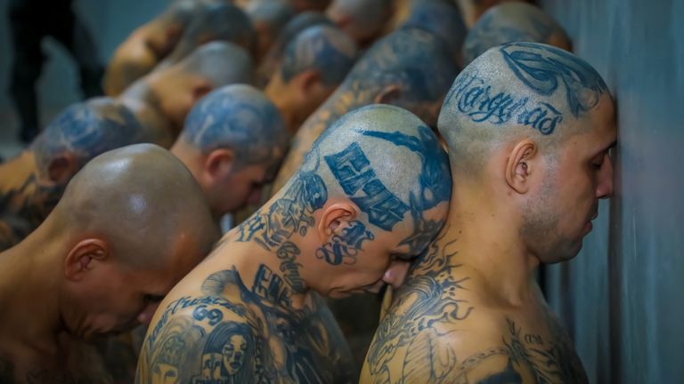 Gang members wait to be taken to their cells after 2000 gang members were transferred to the Terrorism Confinement Center, according to El Salvador&#39;s President Nayib Bukele, in Tecoluca, El Salvador, in this handout distributed to Reuters on February 24, 2023. Secretaria de Prensa de la Presidencia/Handout via REUTERS ATTENTION EDITORS - THIS IMAGE HAS BEEN SUPPLIED BY A THIRD PARTY. NO RESALES. NO ARCHIVES
