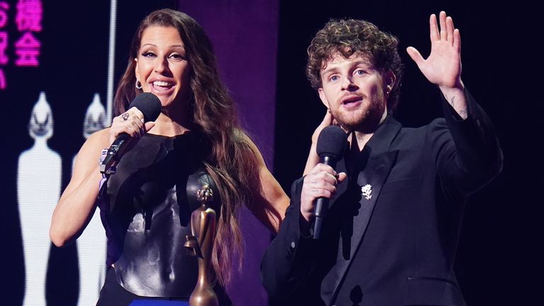 Ellie Goulding and Tom Grennan presenting an award during the Brit Awards 2023 at the O2 Arena, London. Picture date: Saturday February 11, 2023.